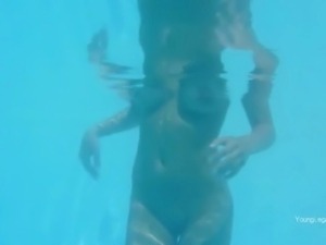Naughty undine naked in the swimmingpool