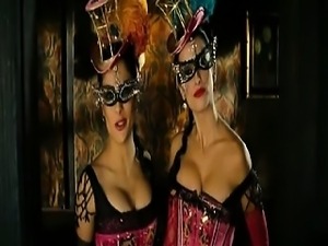 Salma Hayek and Penelope Cruz wearing showgirl outfits that