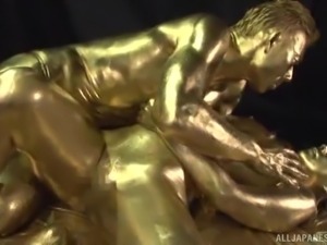 Ai Uehara is a babe covered in golden paint craving a cock