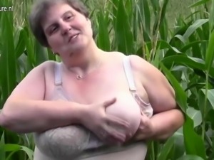 Fat old woman Masturbates on the street in corn