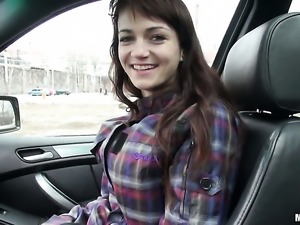 Brunette Aimee gets undressed in the car