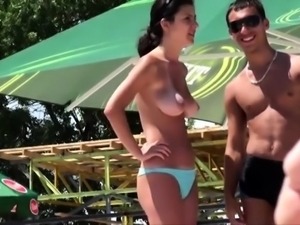 Beach voyeur filming a pretty amateur teen with big boobs