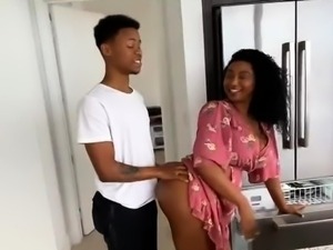 Voluptuous ebony mom has a young black stud plowing her cunt