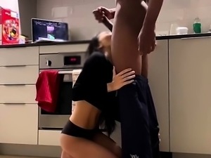 Stunning Asian babe takes on a big black cock in the kitchen