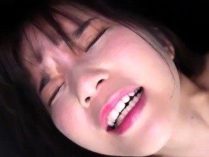 Delightful Oriental teen works her lips on a gang of cocks